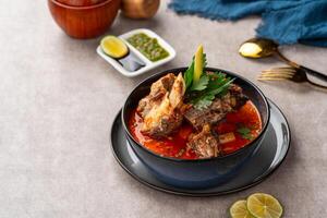 Soto Tangkar is Betawi food. The name Tangkar itself is a term for beef ribs in Betawi language. Soto Tangkar cooked in thin coconut milk soup spiced with red curry. photo