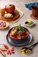 Soto Tangkar is Betawi food. The name Tangkar itself is a term for beef ribs in Betawi language. Soto Tangkar cooked in thin coconut milk soup spiced with red curry. photo