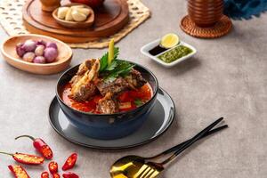 Soto Tangkar is Betawi food. The name Tangkar itself is a term for beef ribs in Betawi language. Soto Tangkar cooked in thin coconut milk soup spiced with red curry. photo
