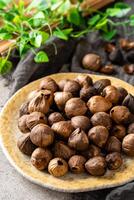 Fermented black garlic. The color is a result of the Maillard reaction or caramelization. Black garlic can help to regulate blood sugar levels photo