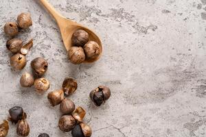 Fermented black garlic. The color is a result of the Maillard reaction or caramelization. Black garlic can help to regulate blood sugar levels photo