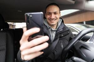 Man Using Gps Navigation System In Car to travel photo