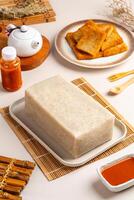 Turnip cake or Chai tow kway. Turnip cake is a common dish or dim sum of Teochew cuisine in Chaoshan, China usually cut into rectangular slices and sometimes pan fried before serving photo