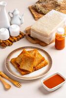 Turnip cake or Chai tow kway. Turnip cake is a common dish or dim sum of Teochew cuisine in Chaoshan, China usually cut into rectangular slices and sometimes pan fried before serving photo