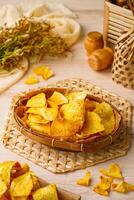 Breadfruit chips or Keripik sukun are food made from breadfruit which is thinly sliced and then fried until dry and crispy. It tastes salty and is usually given a savory onion aroma. photo