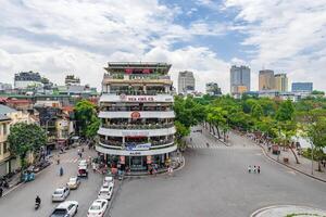 Hanoi, Vietnam - 26 June 2024 Beautiful morning at the building called Shark's Jaw, at Dong Kinh Nghia Thuc Square. Famous landmark, famous destination of Hanoi, Vietnam photo