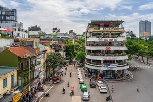 Hanoi, Vietnam - 26 June 2024 Beautiful morning at the building called Shark's Jaw, at Dong Kinh Nghia Thuc Square. Famous landmark, famous destination of Hanoi, Vietnam photo