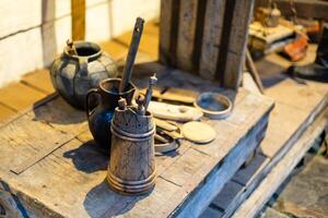 Some old utensils in an old and rural kitchen photo