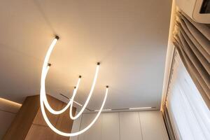 Fragment of a stretch ceiling with the hidden LED illumination photo