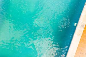 zenithal aerial drone view of part of a swimming pool in summertime photo