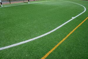 detail of the surface of an artificial grass football field. photo