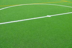 partial view of the center circle of an artificial turf football field photo