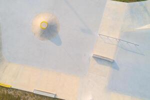 Aerial top view of a public playground for a skateboard in a recreation park. photo
