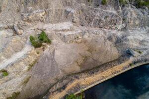aerial top view of a disused open pit wolfram mine photo