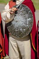 Unrecognizable person disguised in a medieval historical reenactment act. Historical event concept photo