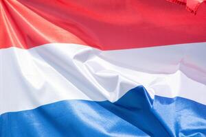 close-up view of the flag of Netherlands fluttering in the wind photo