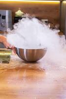 Smoke vapor dry ice in bowl in kitchen photo