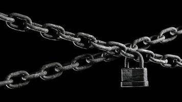 Worn rusted chain and pad lock on black background. Conceptual strength, protection, or security system. photo