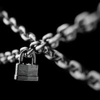 Worn rusted chain and pad lock on black background. Conceptual strength, protection, or security system. Shallow DOF. photo