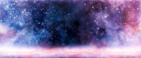 Sparkling lights glittering in ethereal blues purples and pinks. Magical galaxy or nebula background in vibrant dreamy colors. photo