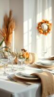 Elegant Table Setting with White Tablecloth, Candle, and Wine Glasses photo