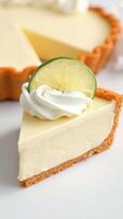 Key Lime Pie Slice with Whipped Cream and Lime Garnish photo