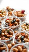 Assorted Nuts and Snacks in Plastic Containers photo