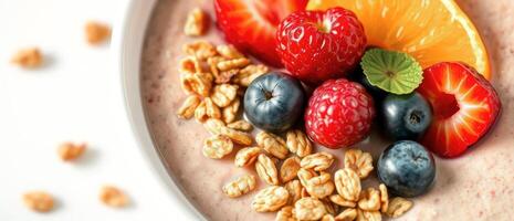 Close-up of a bowl of yogurt with fruit and granola photo