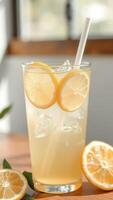 Lemonade with Lemon Slices and Ice in a Glass photo