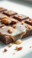 Drizzled Chocolate Bar with Caramel and Nuts photo