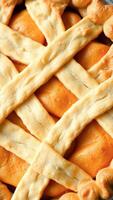 Close-up of golden-brown pie crust with juicy filling photo