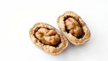 Close-up of Two Opened Walnuts on White Background photo