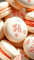 Closeup of White Macarons with Red Chinese Characters photo