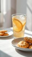 Refreshing Lemonade with Lemon Slice and Cookies in Sunlight photo