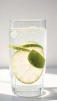 Glass of Sparkling Water with Lime Slices photo
