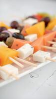 Close up of fruit and cheese skewers photo