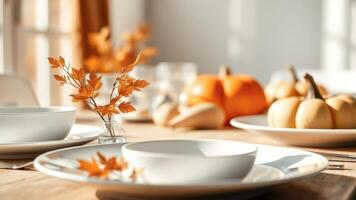 Autumnal Table Setting with Pumpkins and Fall Leaves photo
