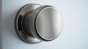 Close-up of a Brushed Nickel Door Knob on a White Door photo