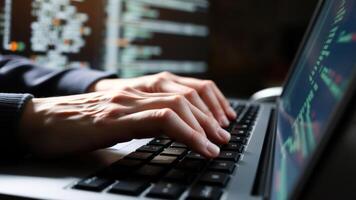 Close Up of Hands Typing on Laptop Keyboard with Code on Screen photo