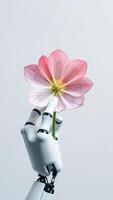 Robotic Hand Holding a Pink Flower photo