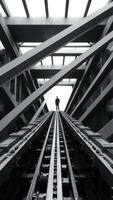 Man walking on a pathway in a modern building photo