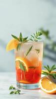 Close-up of a refreshing summer drink with lemon slices and mint photo