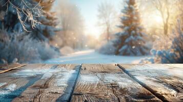 Snow-covered wooden table with a stunning winter forest in the background on a sunny day photo