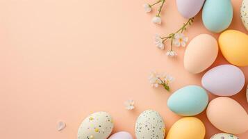 Top view flat lay photo of easter decorations painted pastel eggs, spring blossom on beige background with copy space.