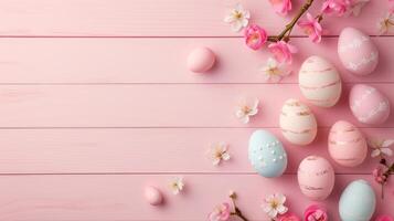Sakura blossom flower, colorful happy easter eggs on wood pink spring background photo