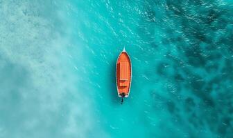 Boat on the water surface from top view, turquoise blue water background from top view, summer seascape from air, island, travel and vacation image photo