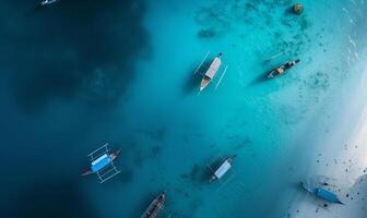 Boats on the water surface from top view, turquoise blue water background from top view, summer seascape from air, island, travel and vacation image photo