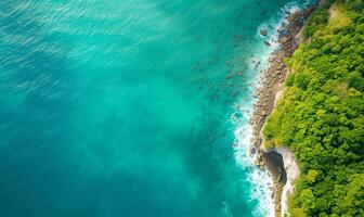 Aerial top view amazing beach with perfect nature, green forest peaceful and rock around island photo