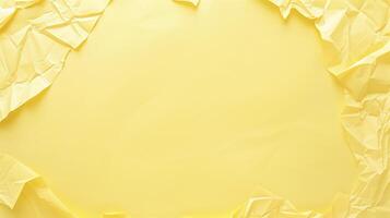 Yellow crumpled paper creating a frame on a bright yellow backdrop, offering space for your text photo