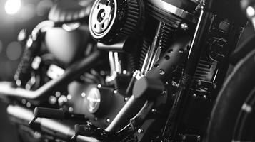 Custom built motorcycle's v-twin engine shines in workshop lighting photo